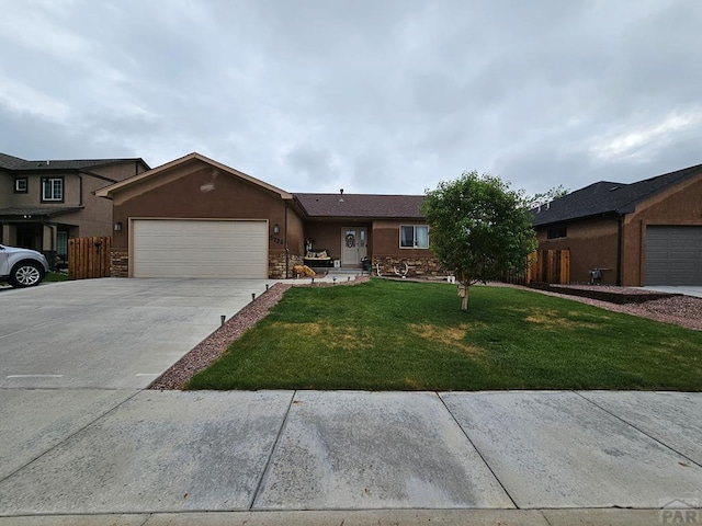 ranch-style home featuring driveway, a front lawn, an attached garage, and stucco siding