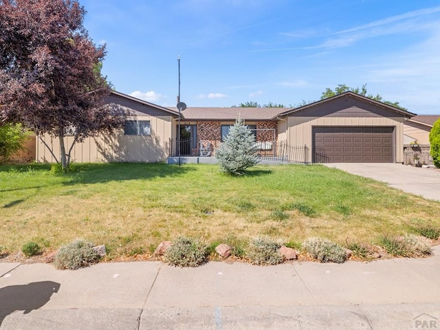 213 Starlite Dr, Pueblo, CO 81005 - ranch-style house with a garage and concrete driveway