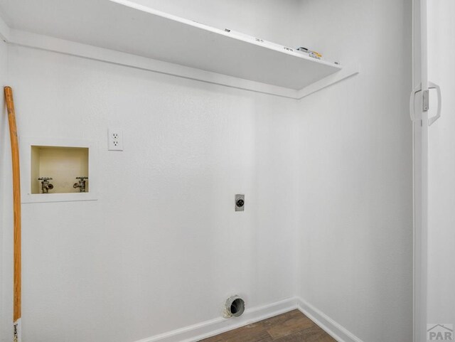 213 Starlite Dr, Pueblo, CO 81005 - washroom featuring washer hookup, dark wood finished floors, and hookup for an electric dryer