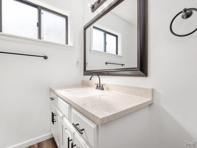213 Starlite Dr, Pueblo, CO 81005 - bathroom featuring vanity and wood finished floors