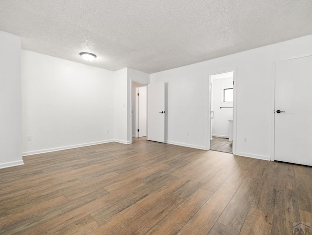 213 Starlite Dr, Pueblo, CO 81005 - unfurnished room with wood finished floors and a textured ceiling