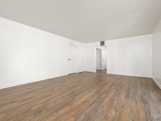 213 Starlite Dr, Pueblo, CO 81005 - unfurnished room with wood finished floors and a textured ceiling