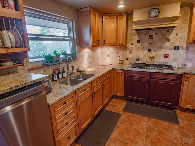 kitchen featuring tasteful backsplash, appliances with stainless steel finishes, a sink, and recessed lighting