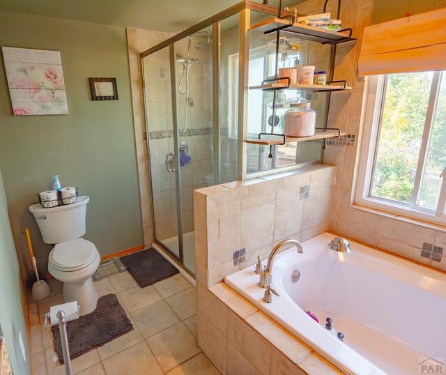 bathroom with toilet, a stall shower, tile patterned flooring, and a garden tub