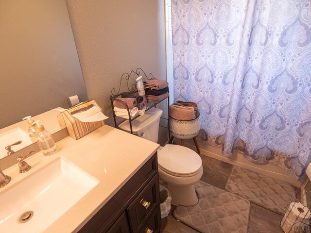 full bathroom with vanity, toilet, and shower / bathtub combination with curtain