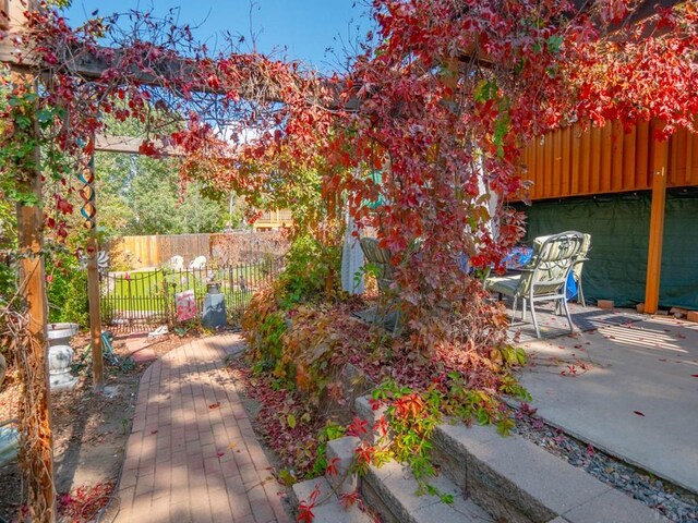 view of patio featuring fence