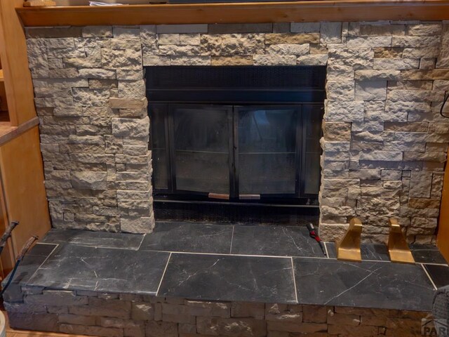 room details featuring a glass covered fireplace