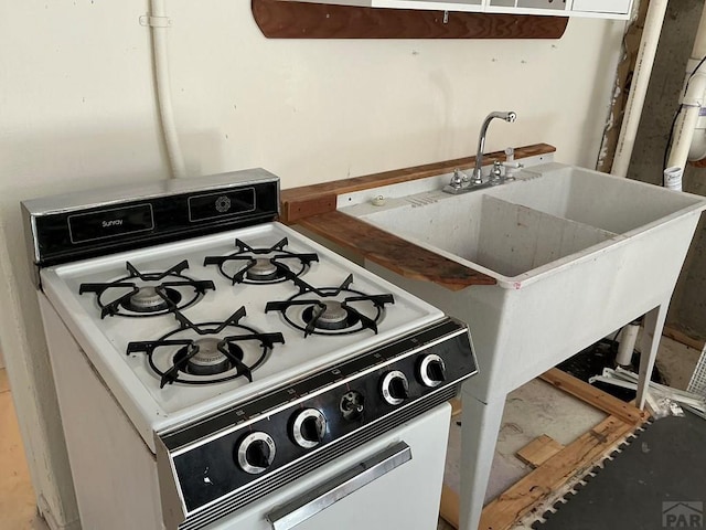 kitchen featuring a sink and gas range gas stove