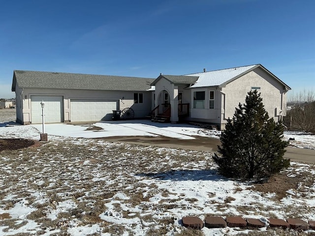 view of front facade featuring an attached garage and stucco siding