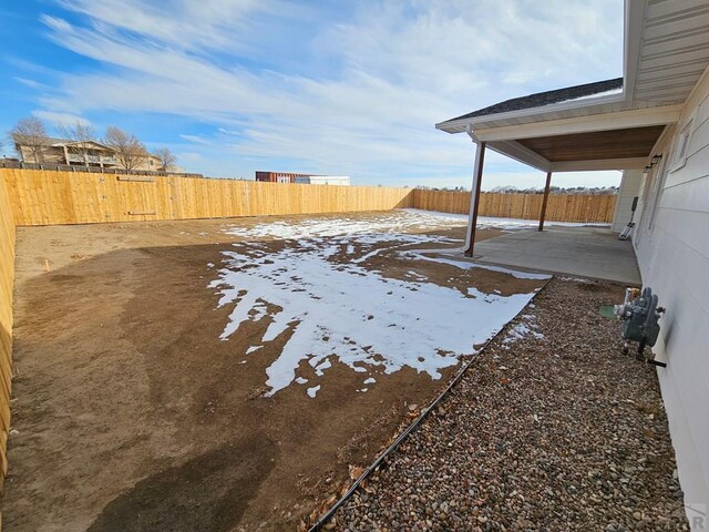 view of yard with a fenced backyard and a patio