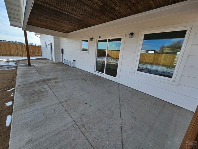 view of patio featuring fence