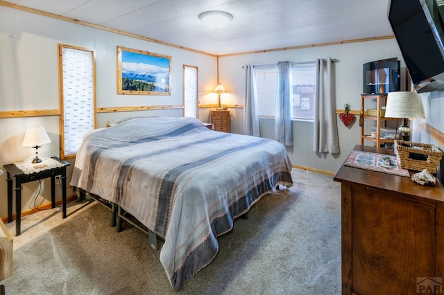 bedroom with carpet floors and ornamental molding