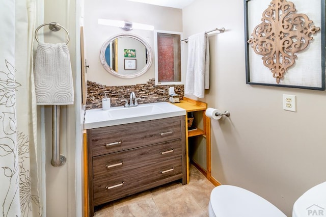 full bath featuring backsplash, tile patterned flooring, vanity, and toilet