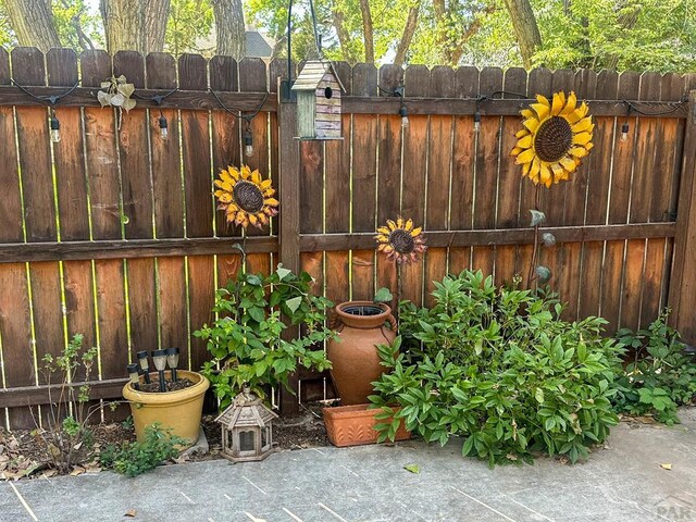 view of patio / terrace featuring a gate and fence