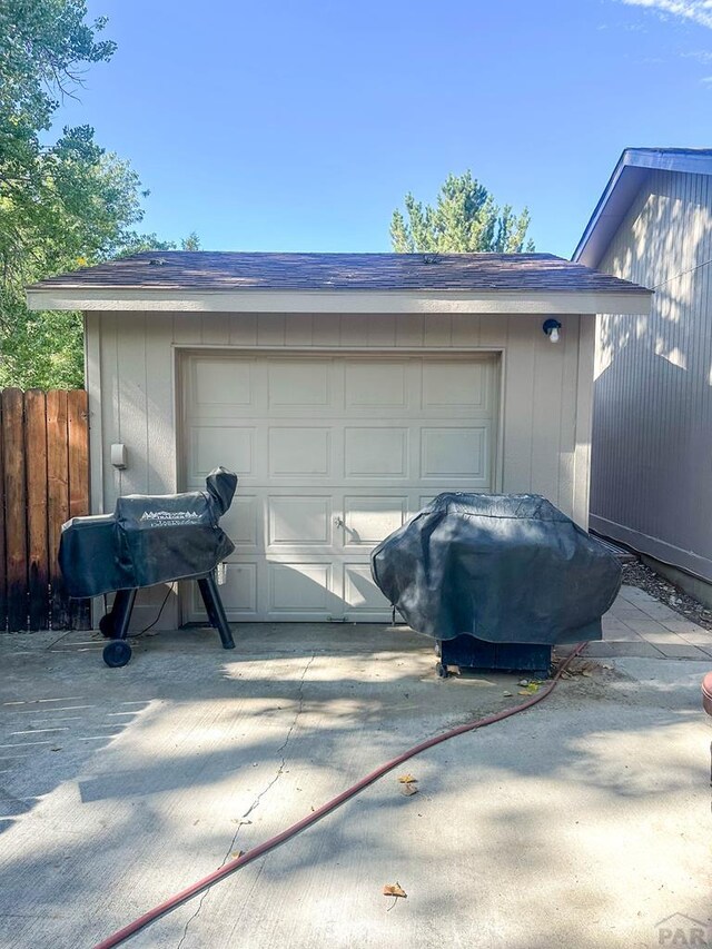 garage with fence