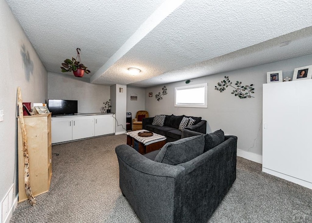 living room with baseboards, dark colored carpet, and a textured ceiling