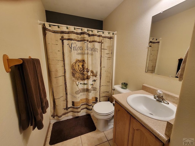 bathroom with vanity, a shower with shower curtain, tile patterned flooring, and toilet