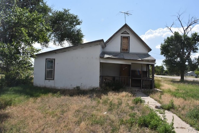 214 Short, Ordway, CO 81063 - back of property featuring a porch and stucco siding