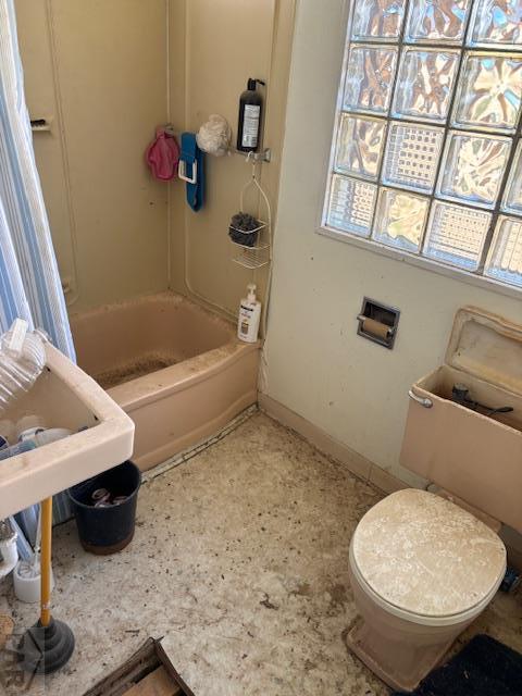 214 Short, Ordway, CO 81063 - bathroom featuring shower / tub combination and toilet