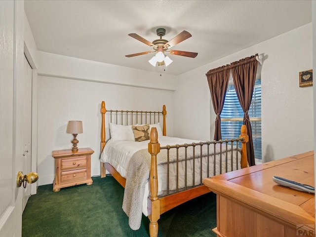 bedroom with a ceiling fan and carpet floors