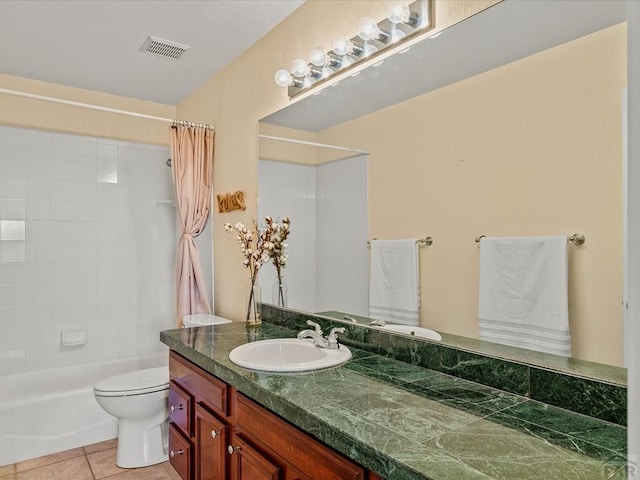 bathroom featuring vanity, visible vents, shower / tub combo, tile patterned floors, and toilet