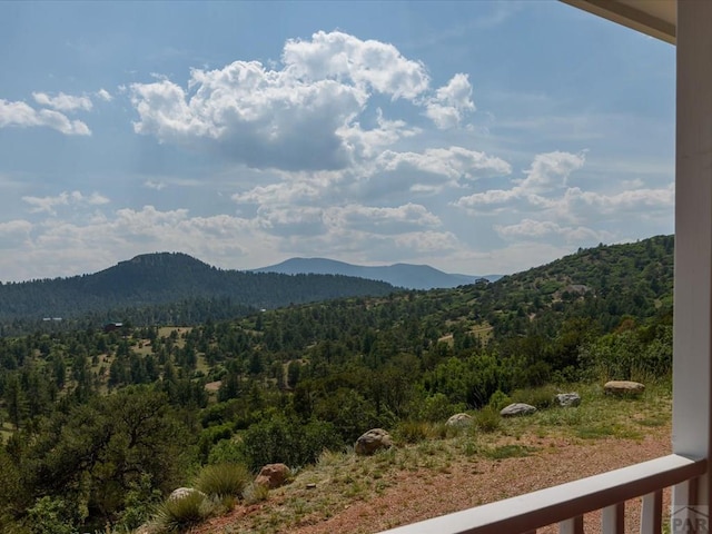 property view of mountains featuring a wooded view