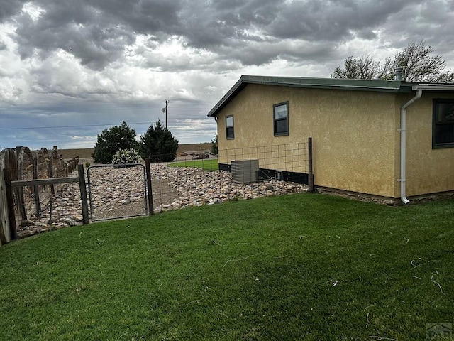 25433 County Rd 25, La Junta, CO 81050 - view of side of property featuring stucco siding and central AC