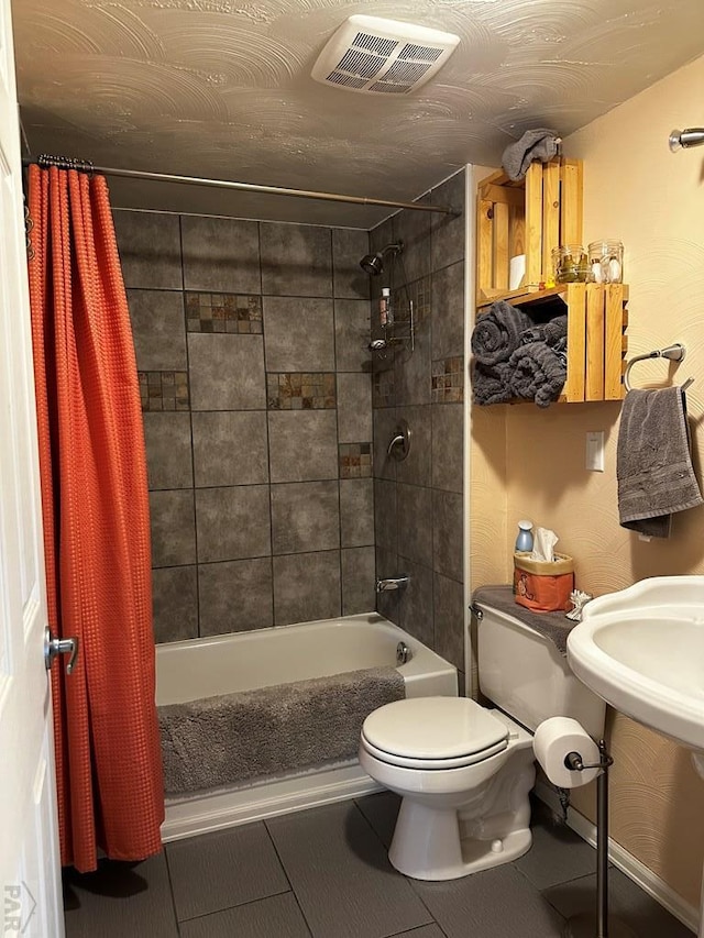 25433 County Rd 25, La Junta, CO 81050 - full bath with shower / bathtub combination with curtain, toilet, and tile patterned flooring