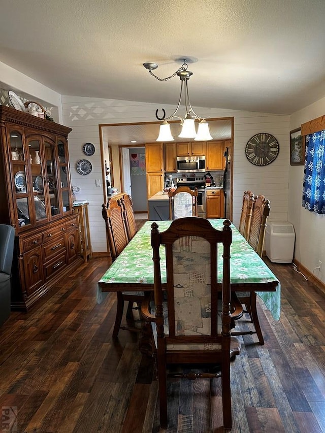 25433 County Rd 25, La Junta, CO 81050 - dining area with dark wood-style floors and baseboards