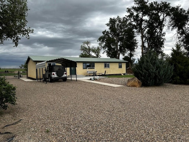 25433 County Rd 25, La Junta, CO 81050 - rear view of house with a detached carport and driveway