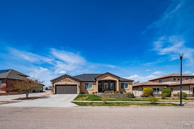 ranch-style home featuring a front yard, an attached garage, stucco siding, and concrete driveway