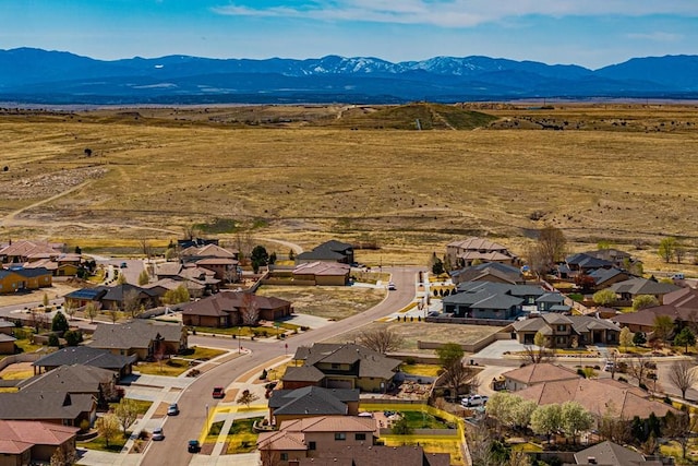 drone / aerial view featuring a mountain view and a residential view
