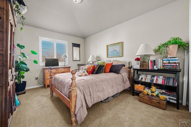bedroom featuring carpet and baseboards