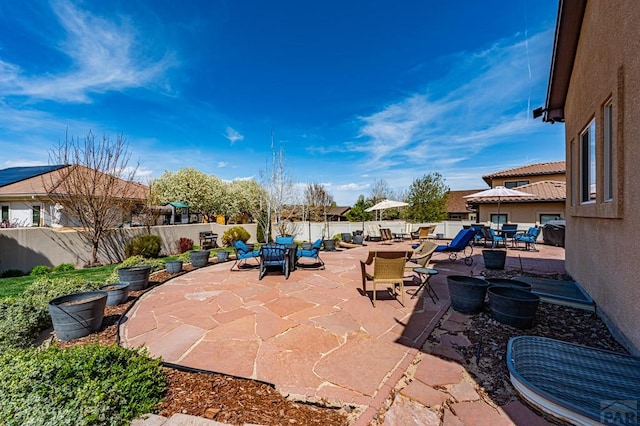 view of patio with a fenced backyard and outdoor dining area