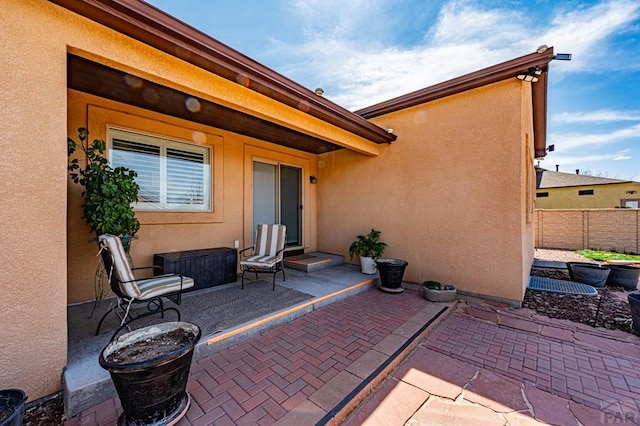 view of patio / terrace featuring fence