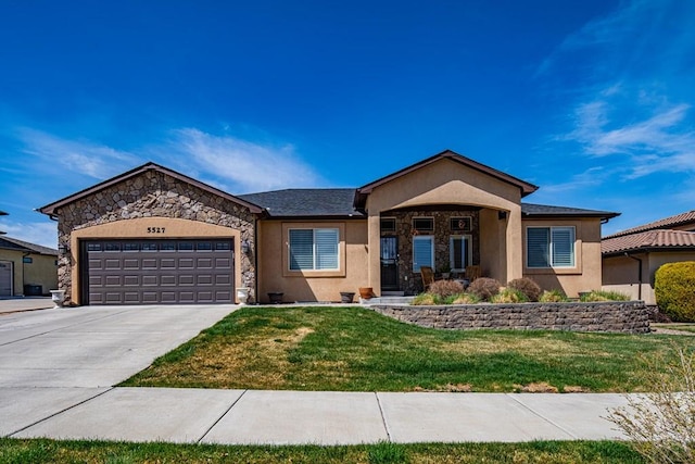 single story home with stone siding, a garage, stucco siding, a front lawn, and driveway