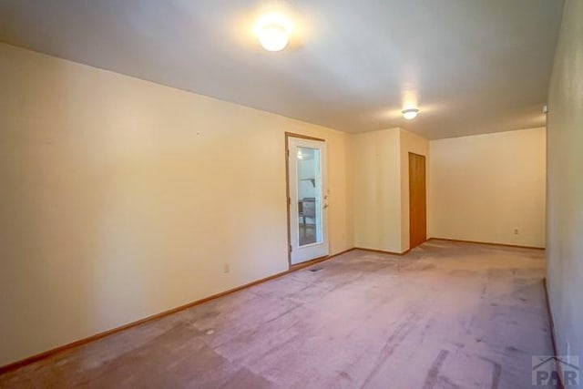 5207 N Creek Rd, Beulah, CO 81023 - spare room with baseboards and light colored carpet
