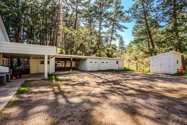 5207 N Creek Rd, Beulah, CO 81023 - garage with a storage shed and view of scattered trees
