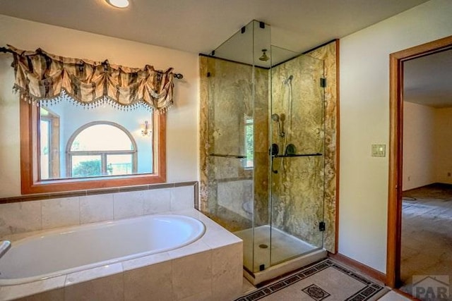 5207 N Creek Rd, Beulah, CO 81023 - full bathroom featuring a shower stall and a bath