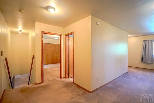 5207 N Creek Rd, Beulah, CO 81023 - hall featuring carpet, an upstairs landing, and baseboards