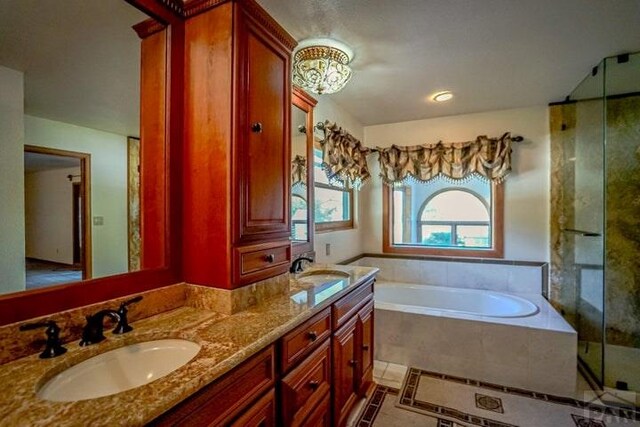 5207 N Creek Rd, Beulah, CO 81023 - full bath featuring a bath, a stall shower, double vanity, and tile patterned floors