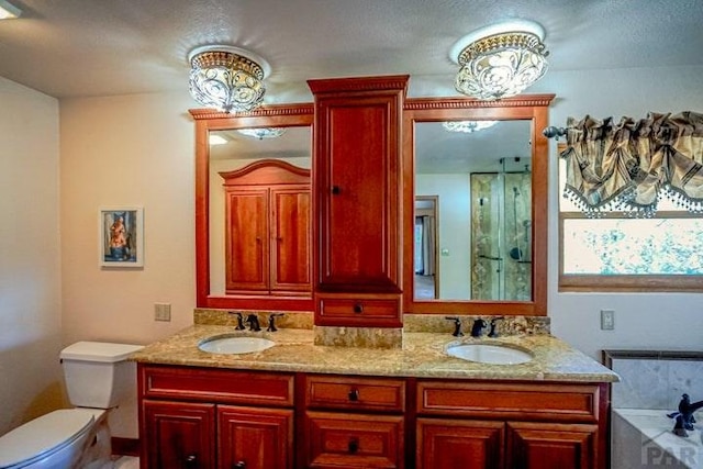 5207 N Creek Rd, Beulah, CO 81023 - full bathroom featuring toilet, double vanity, a garden tub, and an enclosed shower