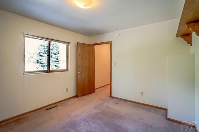 5207 N Creek Rd, Beulah, CO 81023 - empty room featuring light carpet and baseboards