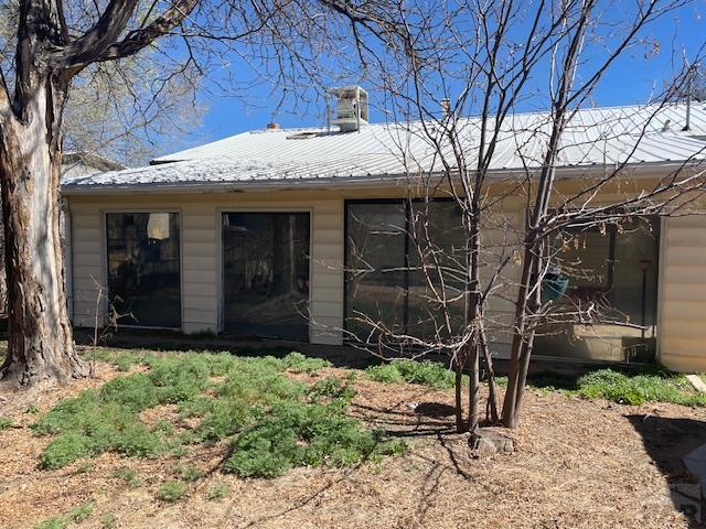 exterior space with metal roof