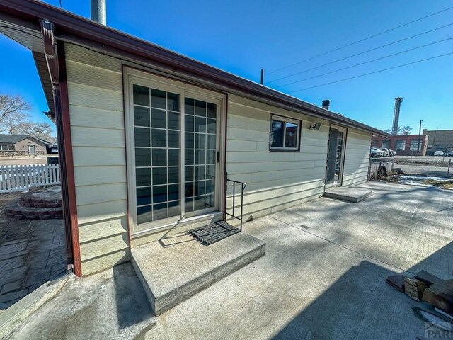 back of house with fence and a patio