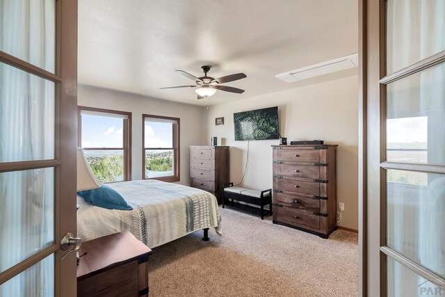 bedroom with carpet, baseboards, and a ceiling fan