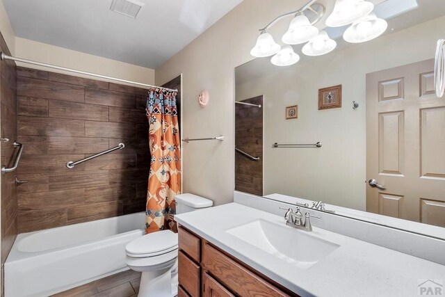 full bath with visible vents, toilet, an inviting chandelier, shower / bathtub combination with curtain, and vanity