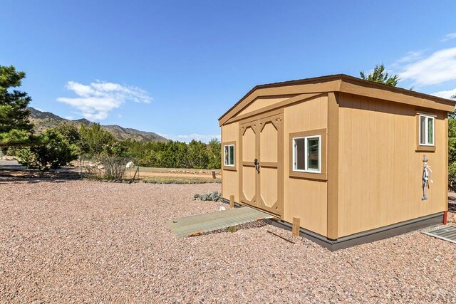 view of shed with a mountain view