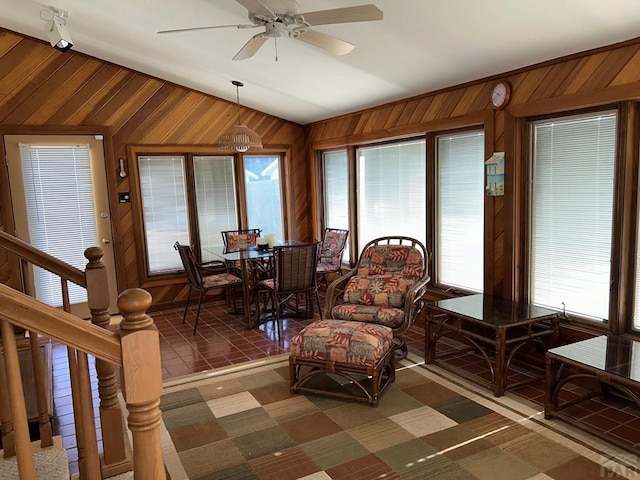 interior space with vaulted ceiling and a ceiling fan