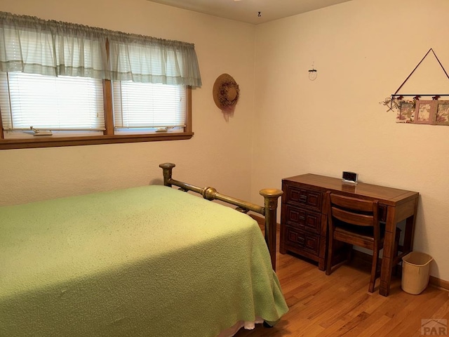 bedroom featuring wood finished floors